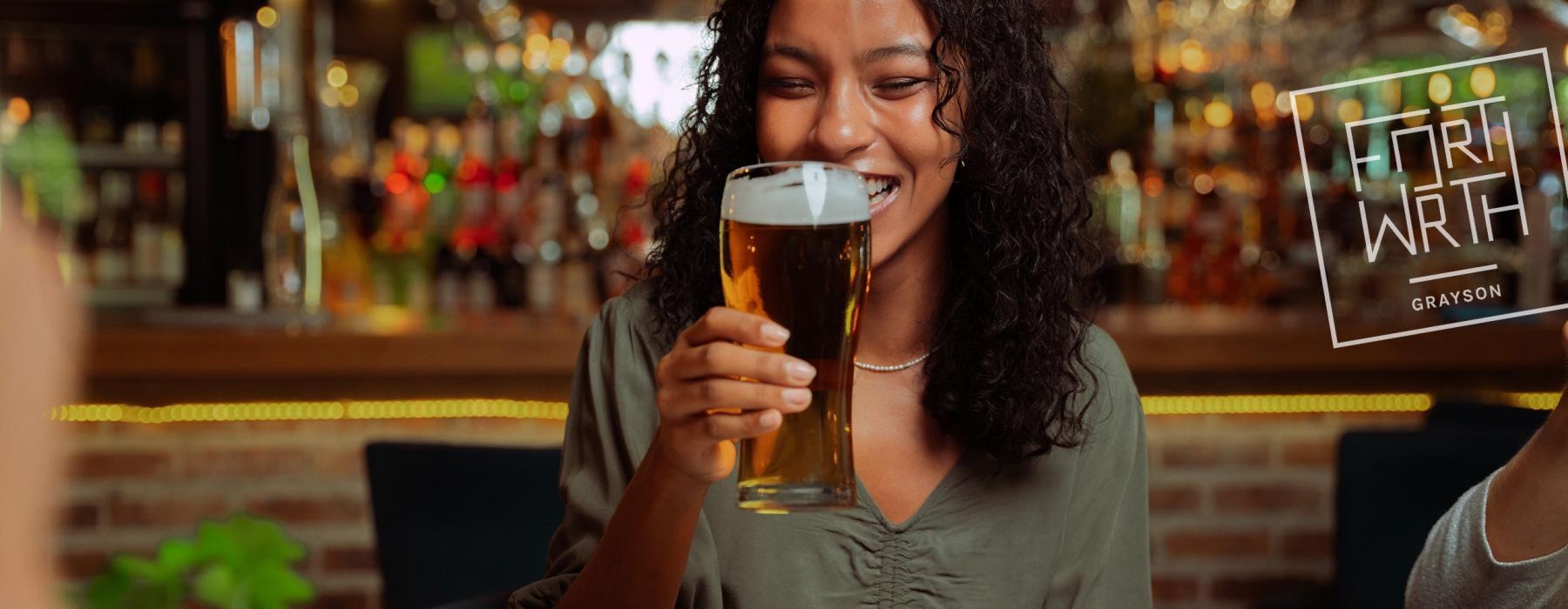 a person drinking a beer